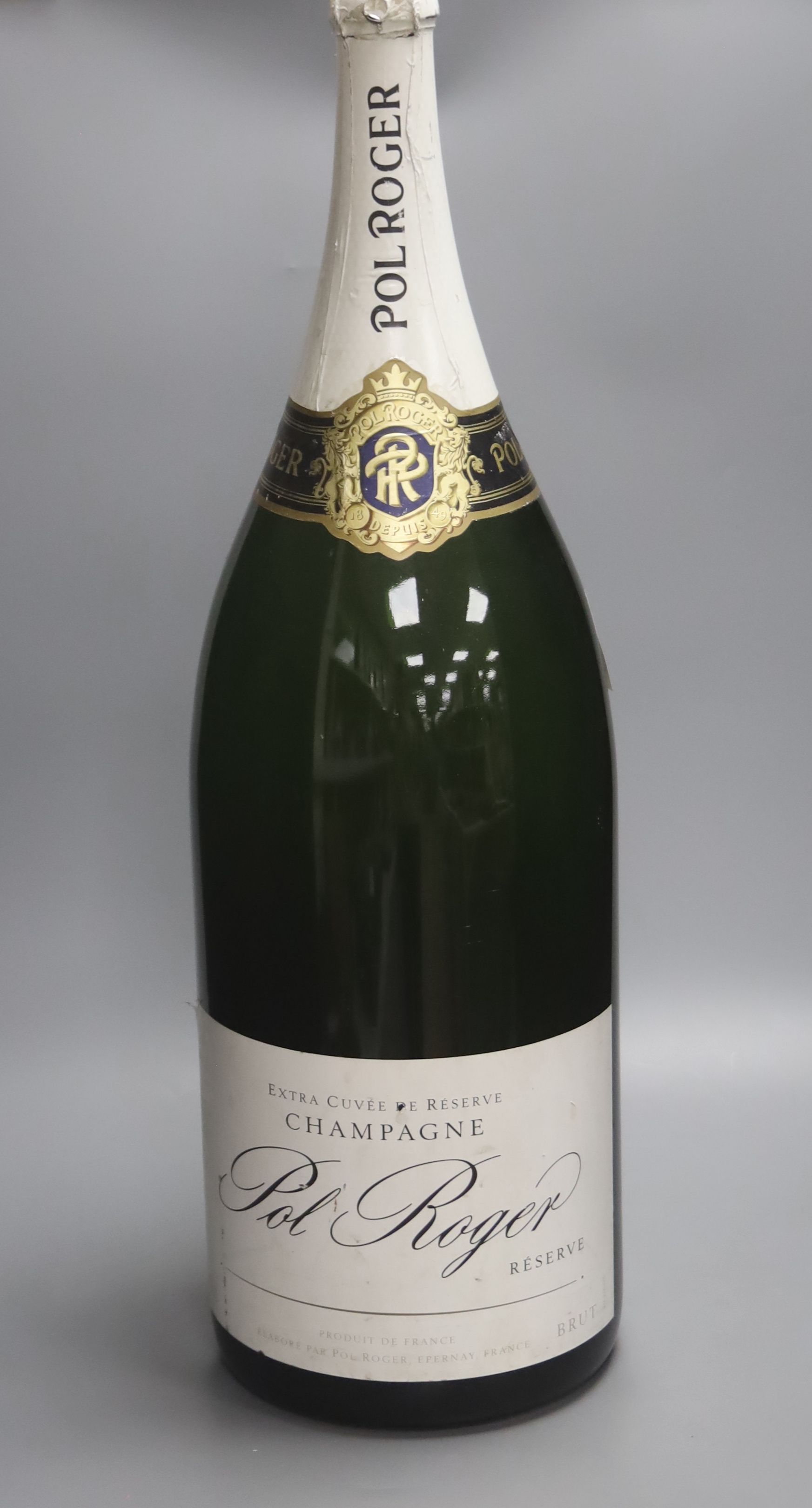 A vacant Nebuchadnezzar bottle of Pol Roger reserve champagne, 72cm high